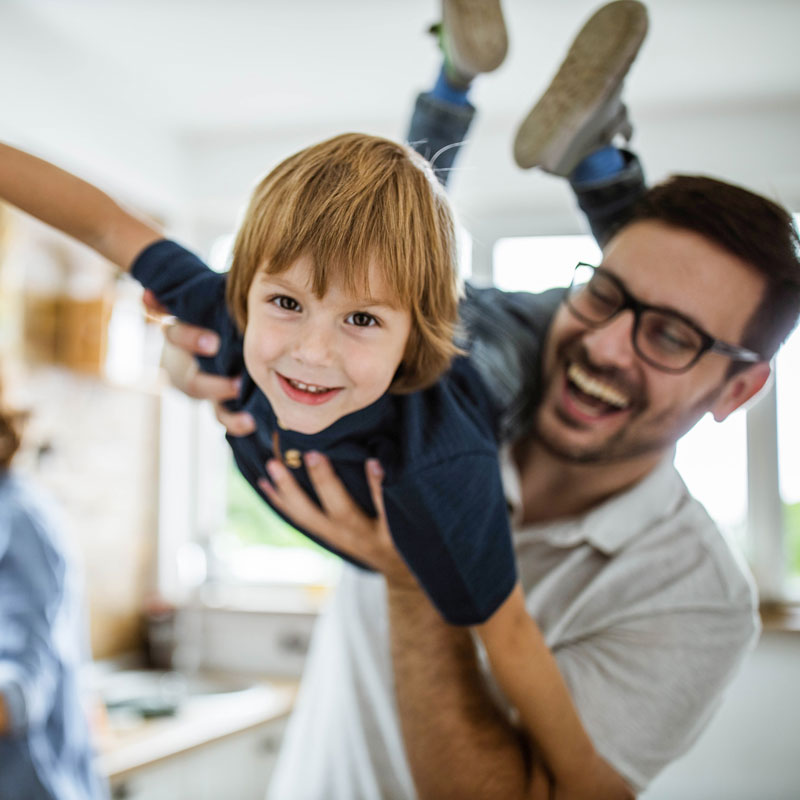 dad and son playing together